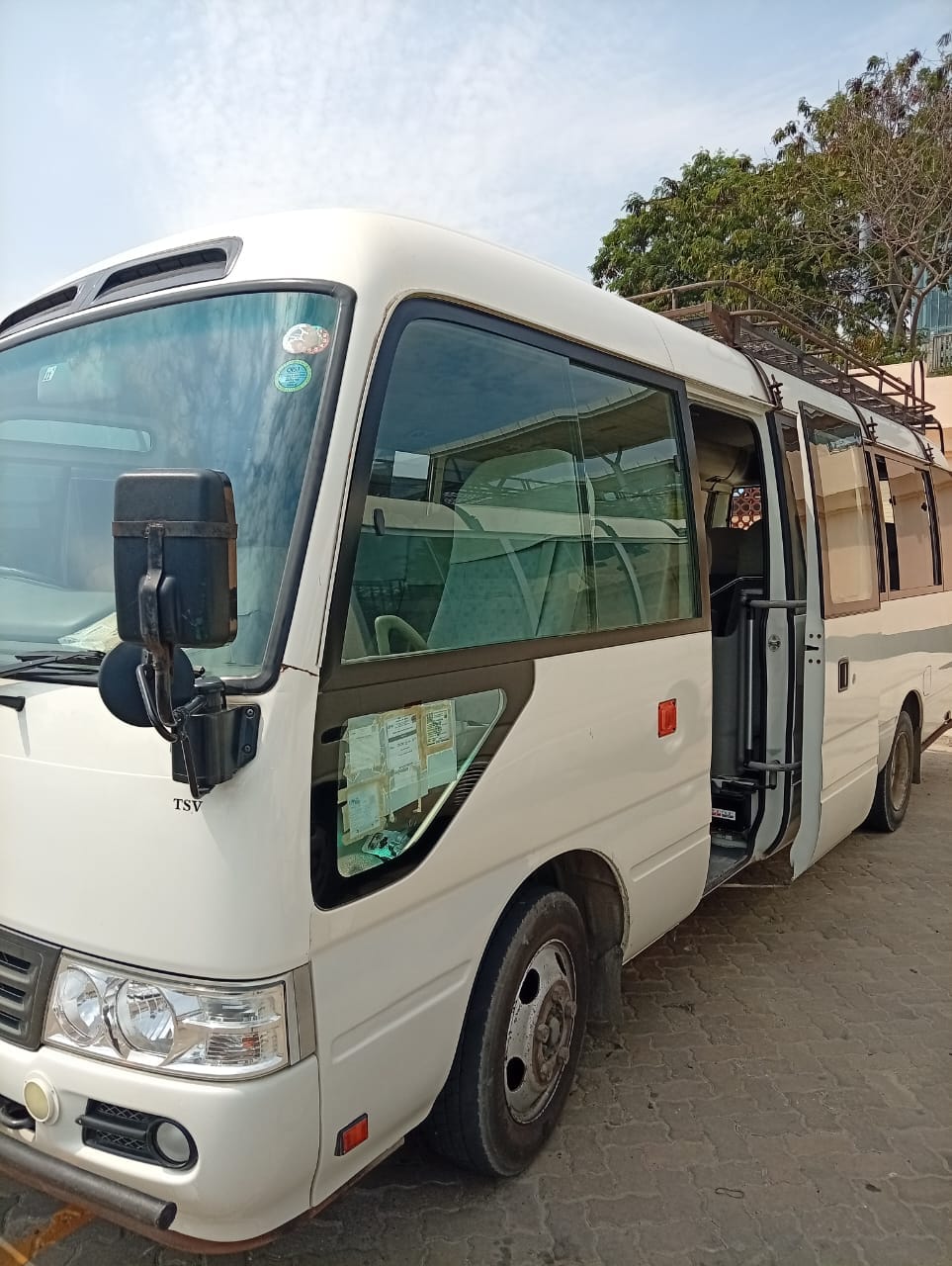 White Toyota Coaster car hire in Kenya